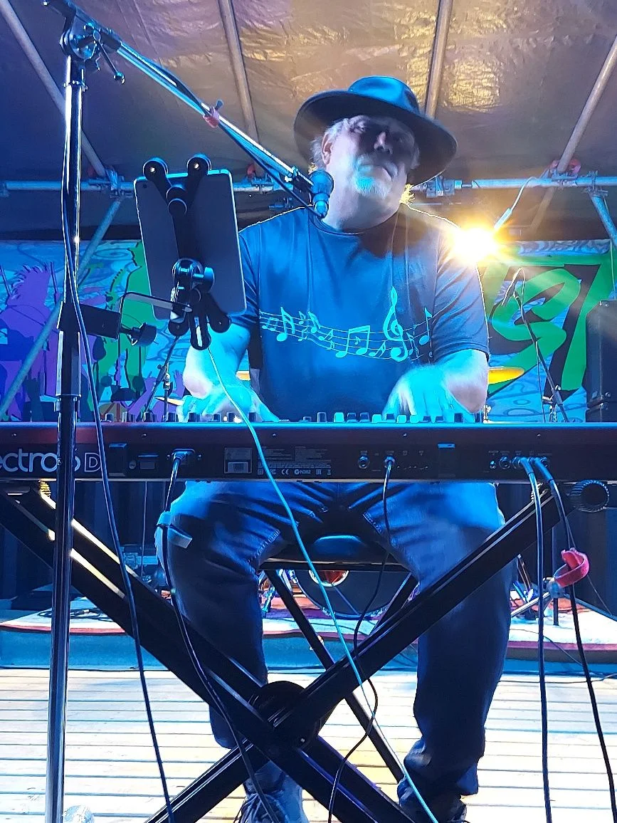 Roy performing at outdoor festival